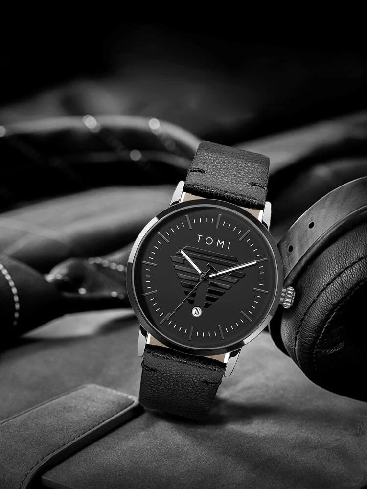 TOMI T-042 black dial men's date watch displayed with headphones and black leather strap