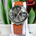 TOMI T-075 luxury watch with a dark dial and a textured orange-brown leather band