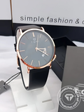 TOMI T-018 rose gold quartz stainless steel watch with black dial on display stand