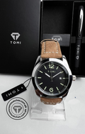 Black dial TOMI T-095 with vintage brown leather strap on display
