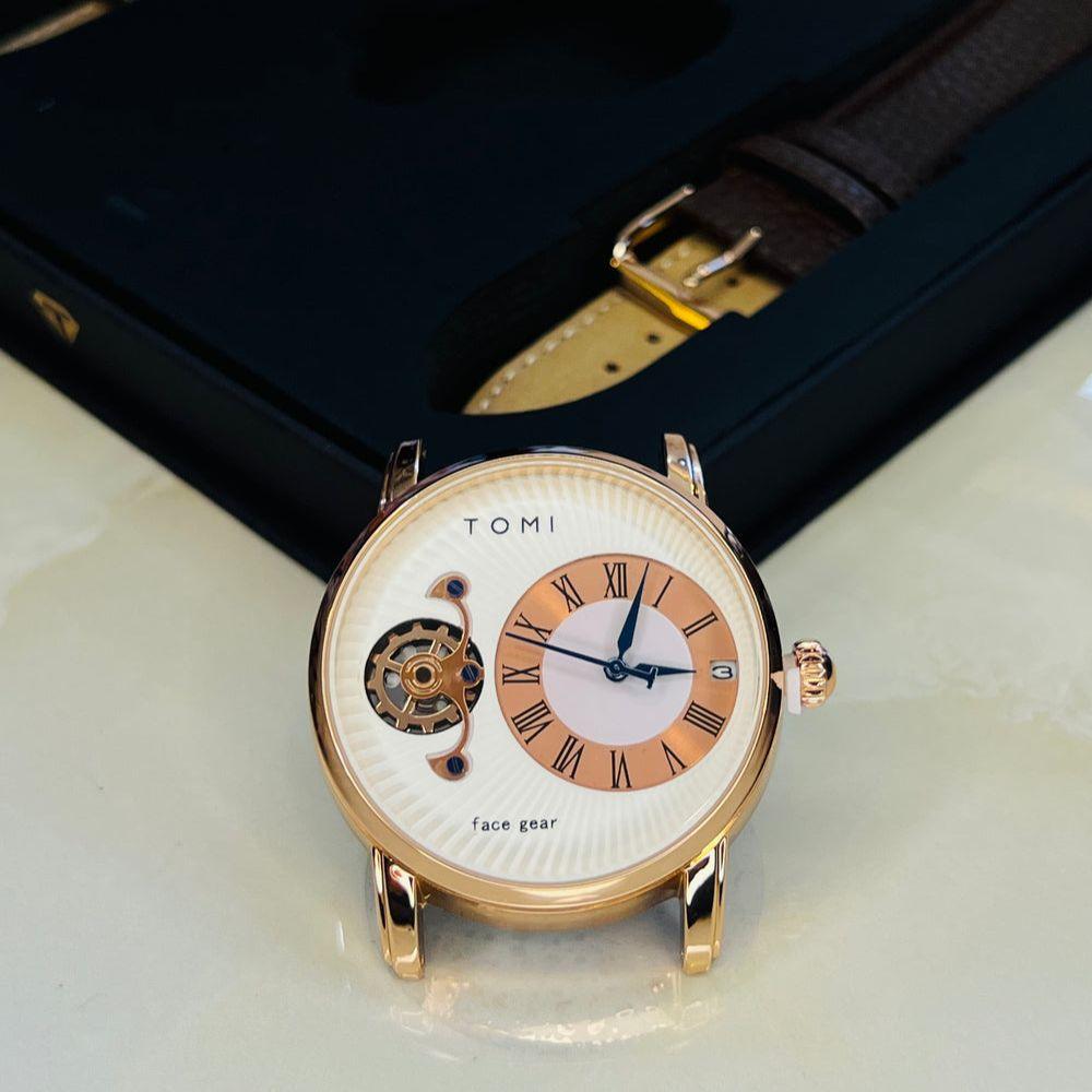 Tomi T-104 Dual Strap Pair Watch photographed with a rose gold-tone case and brown replacement strap.