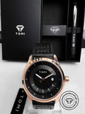 TOMI T-099 men's watch with black dial and rose gold case displayed beside a premium pen gift box