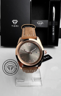 Rose gold case and smoky grey dial of the TOMI T-095 leather watch