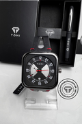 Black dial TOMI T-094 watch with red accents and black leather strap displayed on a stand