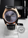 Front view of TOMI T-095 blue dial watch paired with a premium TOMI pen