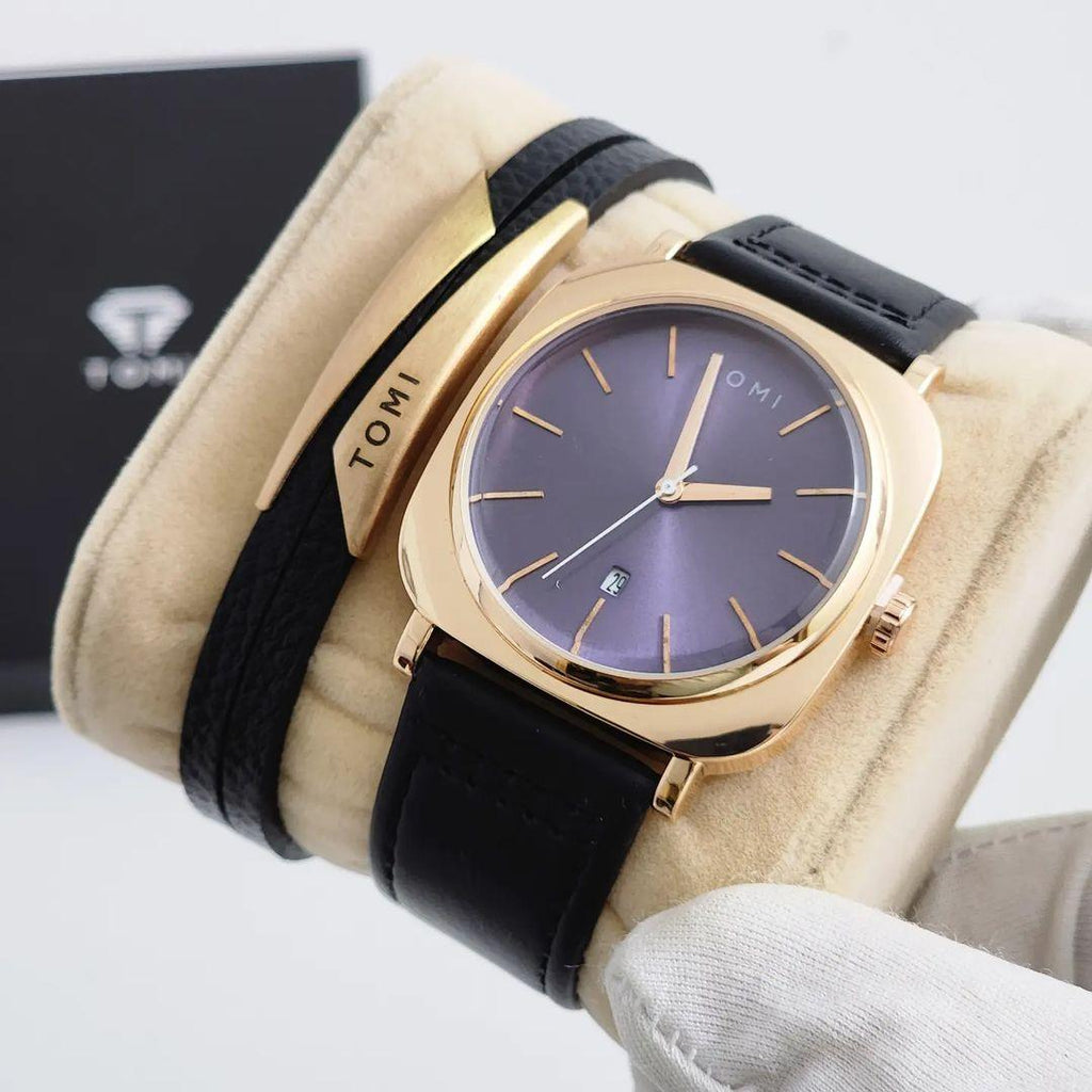 TOMI T-084 Business Watch & Bracelet Set – Rose gold-cased watch with a deep blue dial, black leather strap, and a gold-toned cuff bracelet.